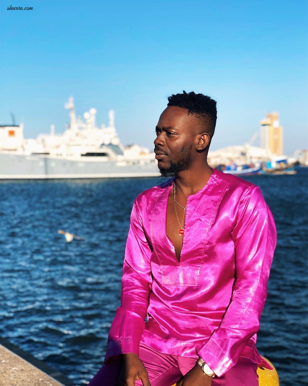 Of Course Adekunle Gold Wears Fuchsia Silk Set When He’s On Vacation